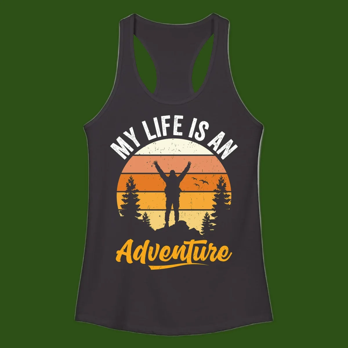 Retro sunset illustration with silhouette of person celebrating arms raised, evergreen trees and mountains, text 'My Life Is An Adventure'