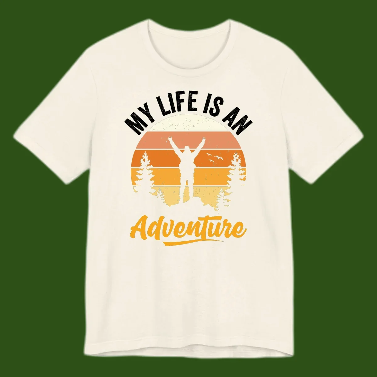 Retro sunset illustration with silhouette of person celebrating arms raised, evergreen trees and mountains, text 'My Life Is An Adventure'