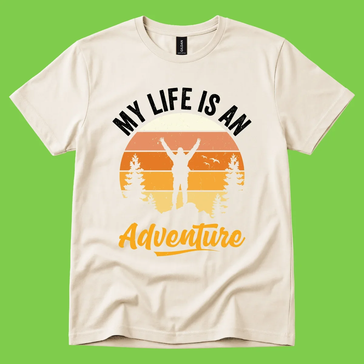 Retro sunset illustration with silhouette of person celebrating arms raised, evergreen trees and mountains, text 'My Life Is An Adventure'