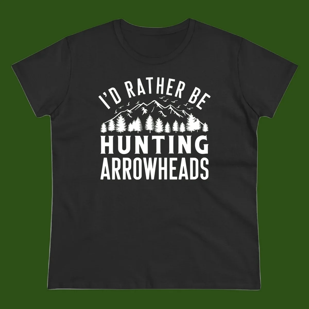 Mountain landscape with evergreen trees and birds, white text reading 'I'd Rather Be Hunting Arrowheads' on gray background