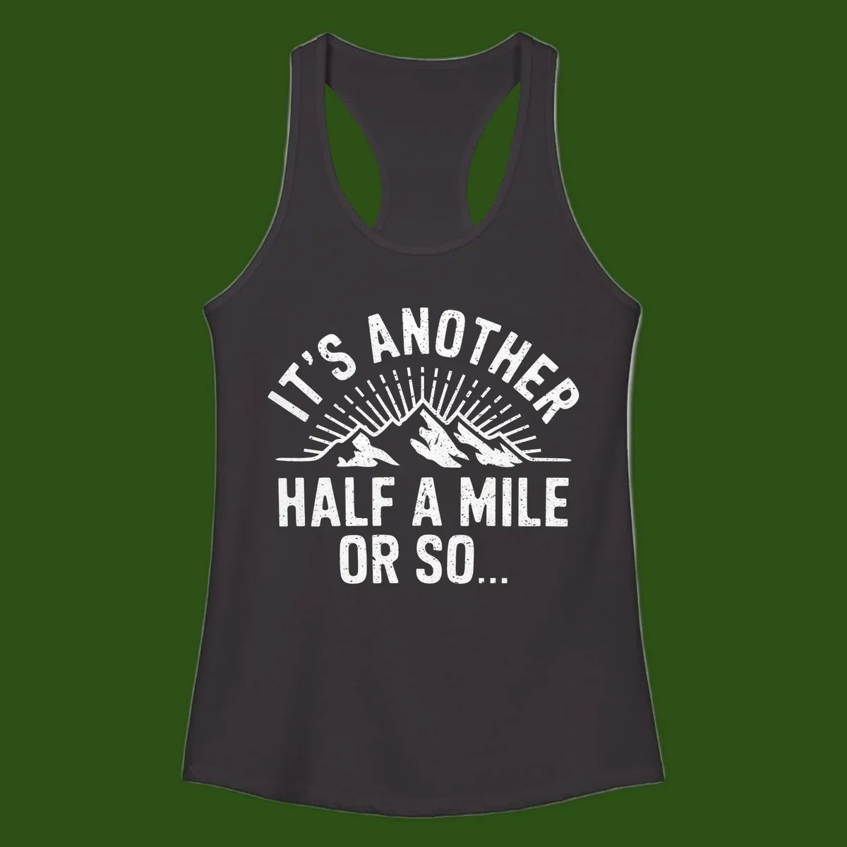 Retro distressed design with mountain peaks and sun rays, text reads 'It's Another Half A Mile Or So' - humorous hiking and camping artwork
