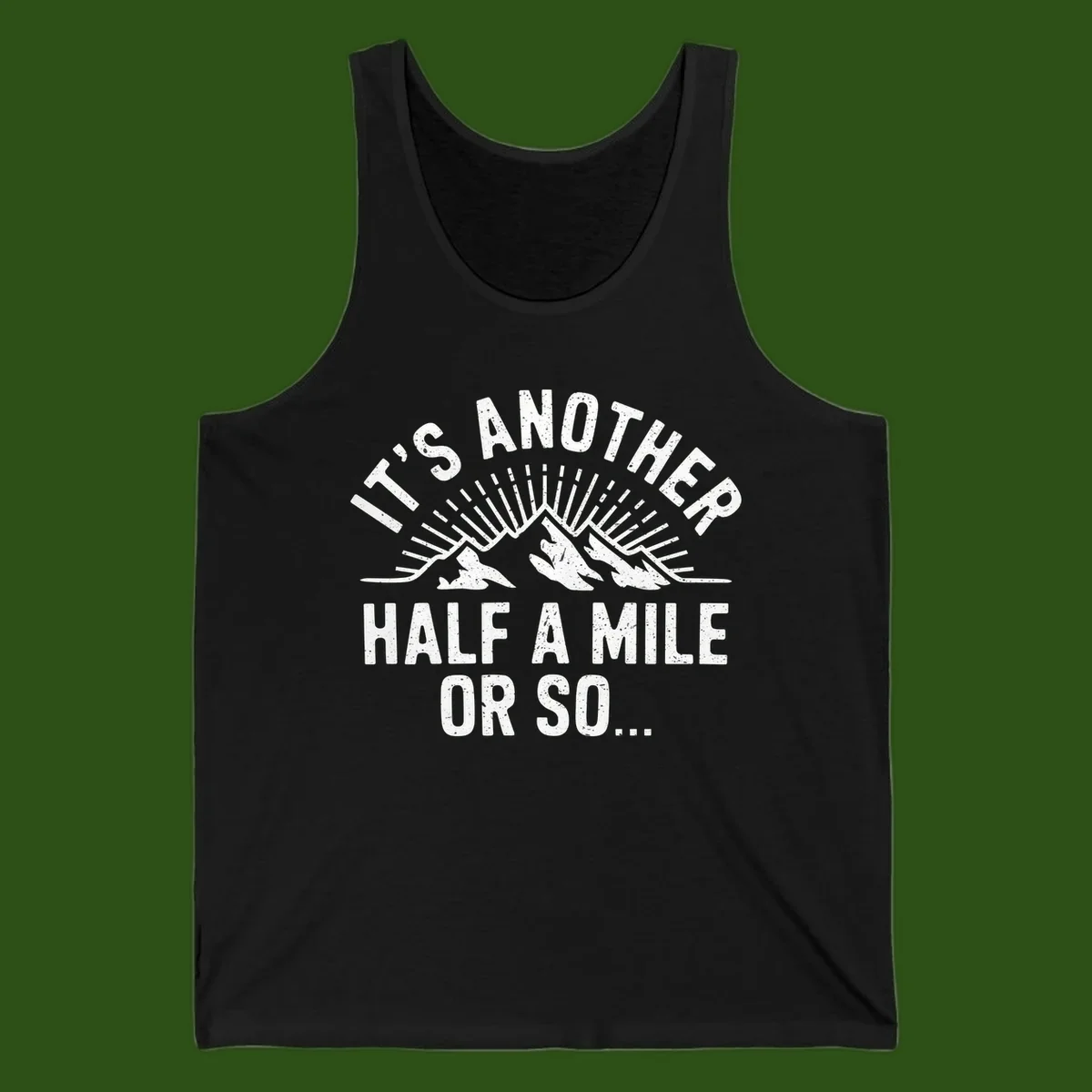 Retro distressed design with mountain peaks and sun rays, text reads 'It's Another Half A Mile Or So' - humorous hiking and camping artwork