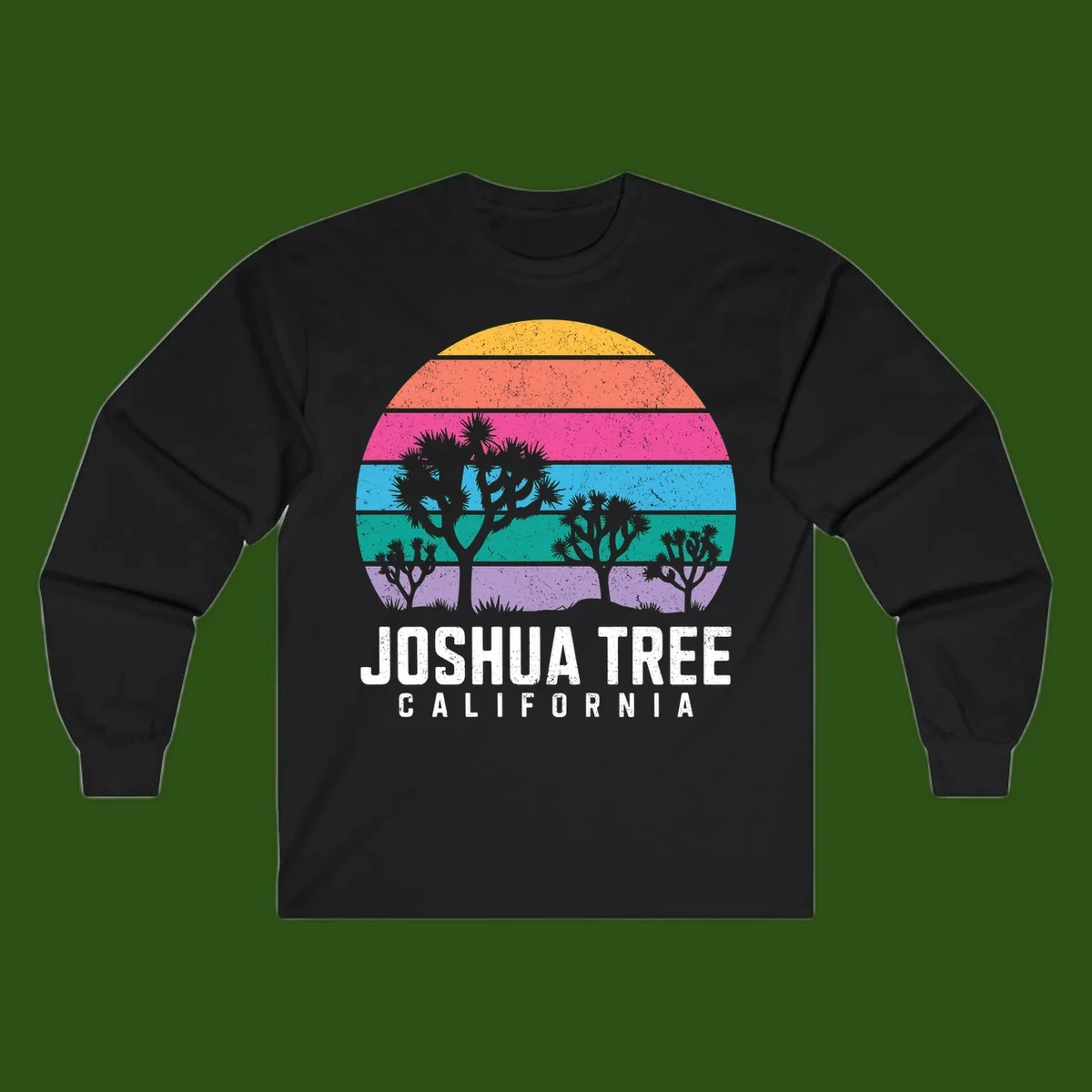 Joshua tree desert stripes design with silhouetted trees across rainbow horizontal color bands and distressed texture.