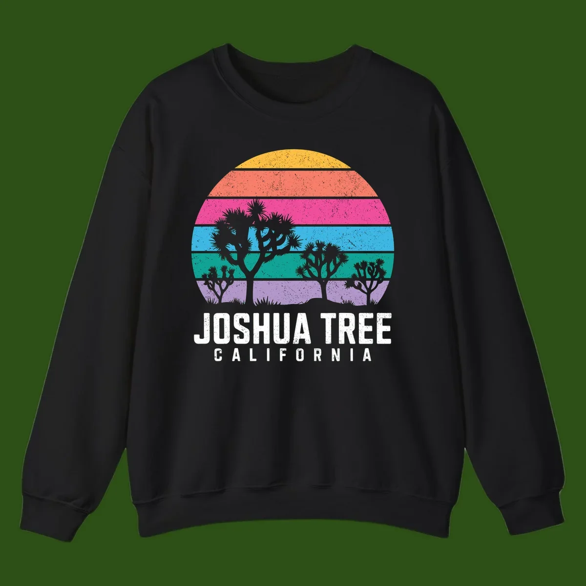 Joshua tree desert stripes design with silhouetted trees across rainbow horizontal color bands and distressed texture.