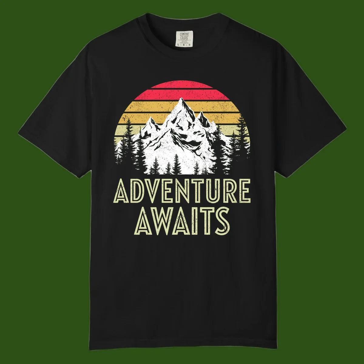 Retro adventure awaits design with snow-capped mountains, pine forest silhouettes, and vintage sunset stripes in distressed style.