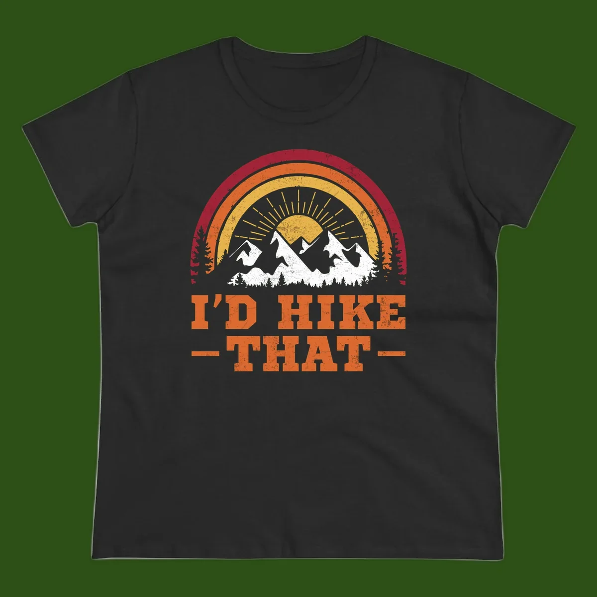 Vintage badge design with snow-capped mountains, evergreen trees, golden sun rays, and text reading 'I'd Hike That' in retro style