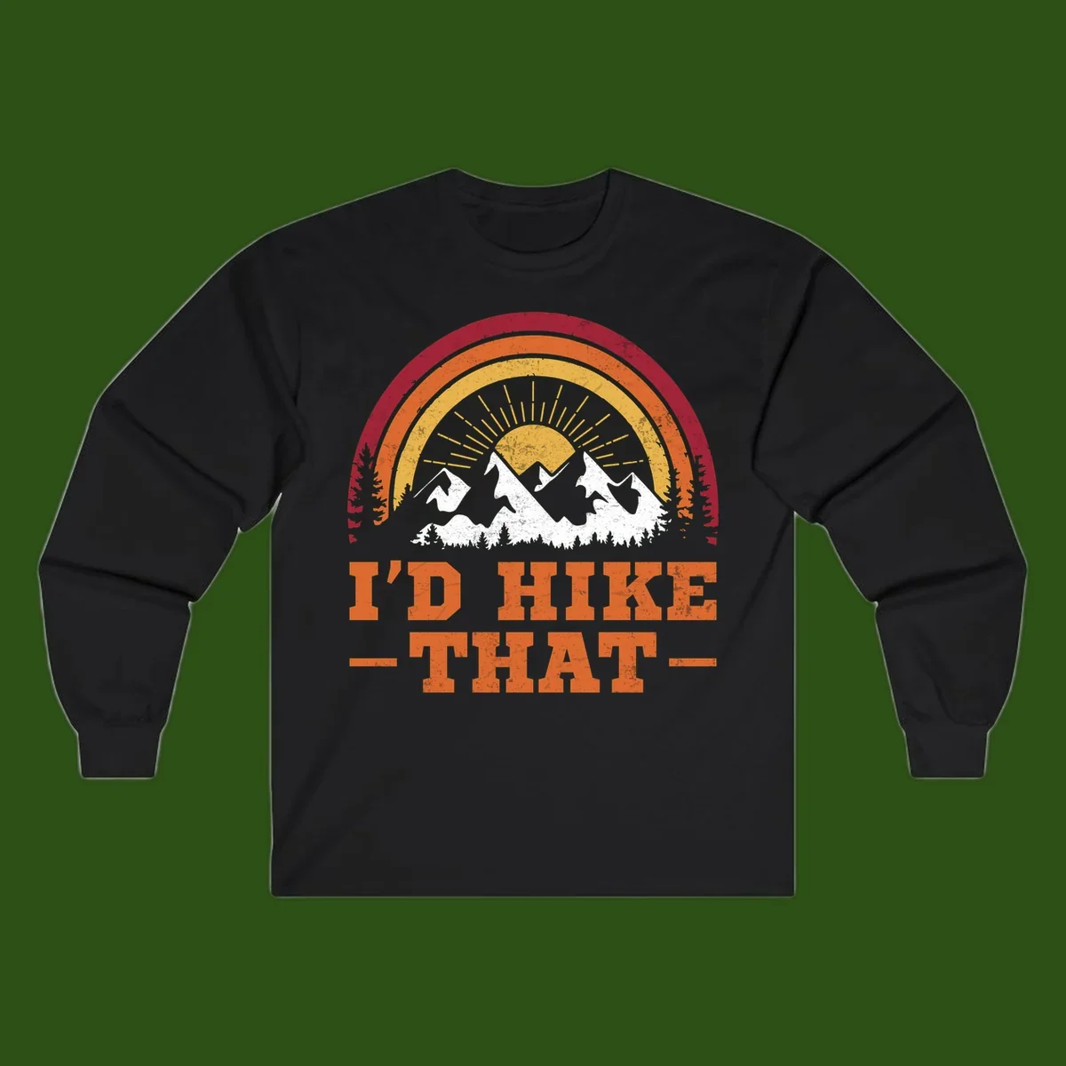 Vintage badge design with snow-capped mountains, evergreen trees, golden sun rays, and text reading 'I'd Hike That' in retro style
