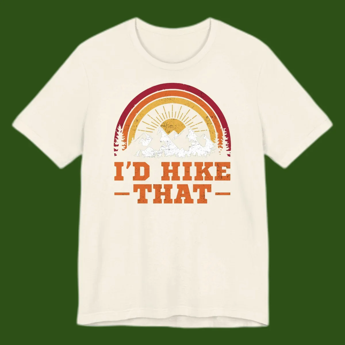 Vintage badge design with snow-capped mountains, evergreen trees, golden sun rays, and text reading 'I'd Hike That' in retro style