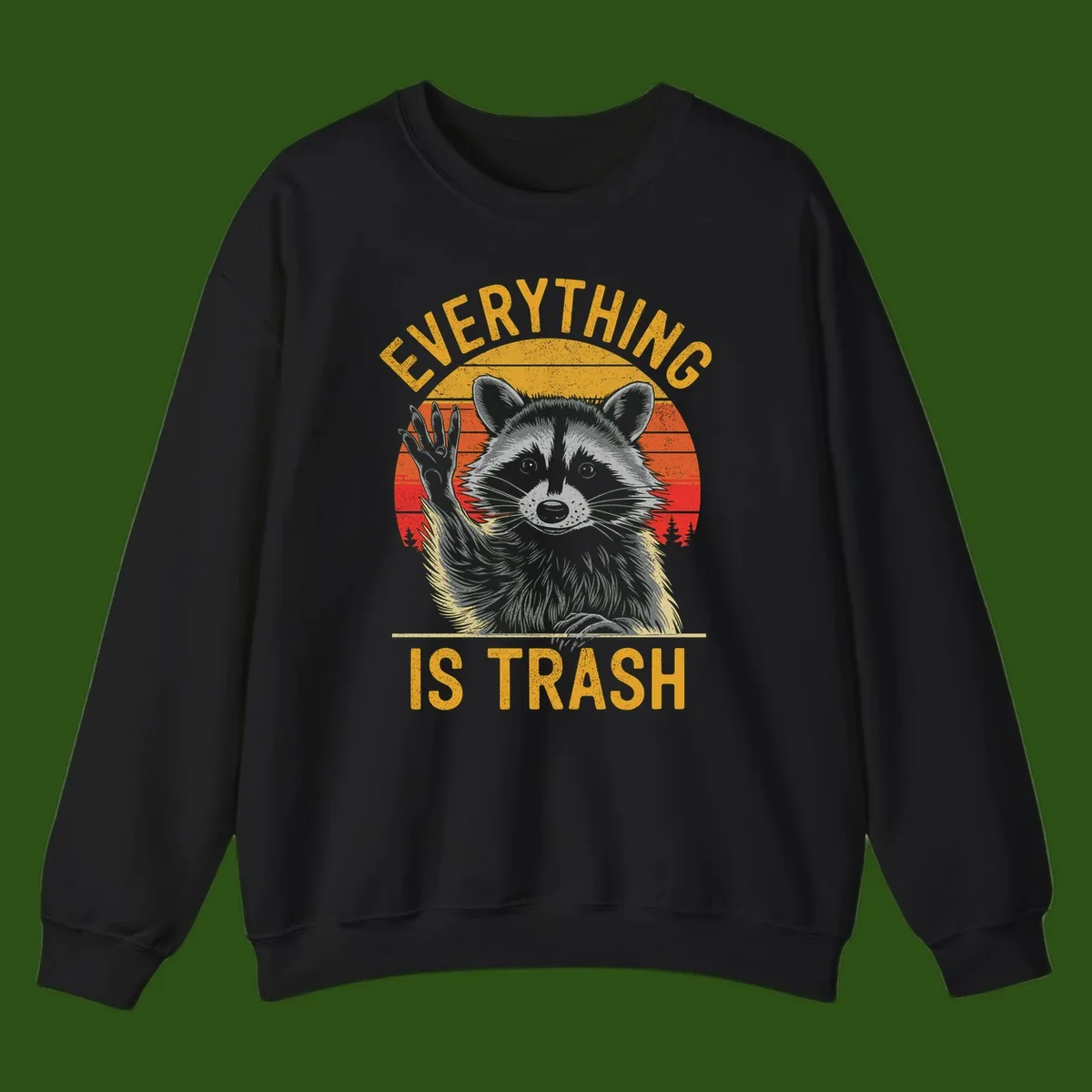 Vintage-style illustration of a raccoon with raised paw against retro sunset stripes, text reading 'Everything Is Trash' in distressed gold lettering