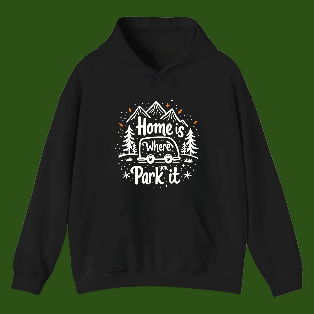 Illustrated winter camping scene with travel trailer, mountains, trees, and snowflakes with text 'Home is Where you Park it'