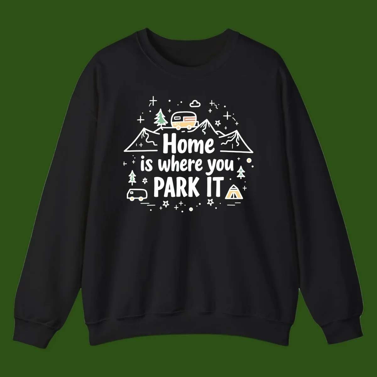 Illustrated design with vintage travel trailer parked on mountain road, evergreen trees, tent, and text reading 'Home is where you park it' on gray background.