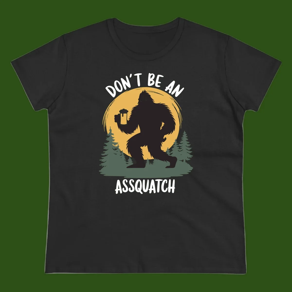 Black silhouette of Bigfoot holding a beer mug under a full moon with pine trees, text reads don't be an assquatch