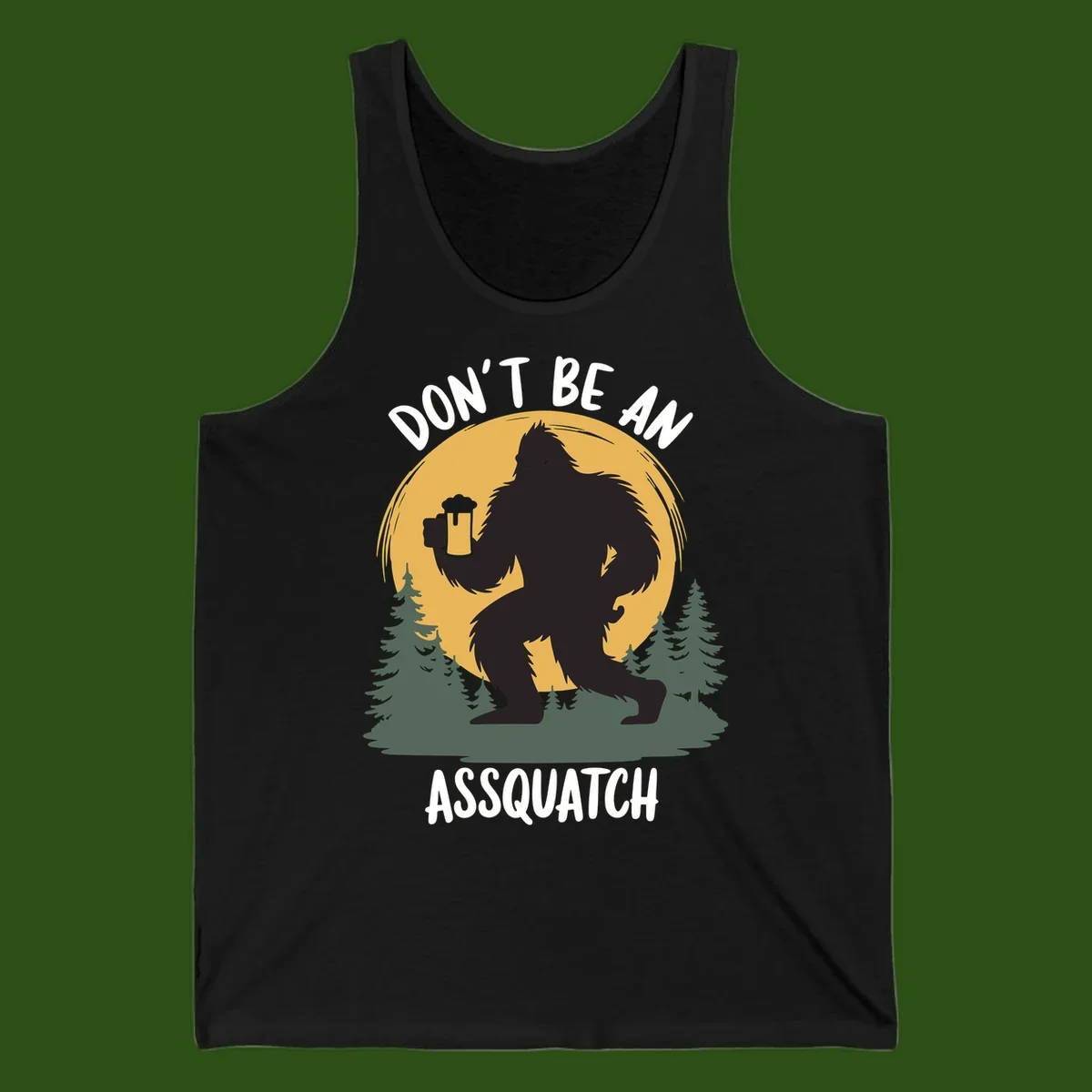 Black silhouette of Bigfoot holding a beer mug under a full moon with pine trees, text reads don't be an assquatch