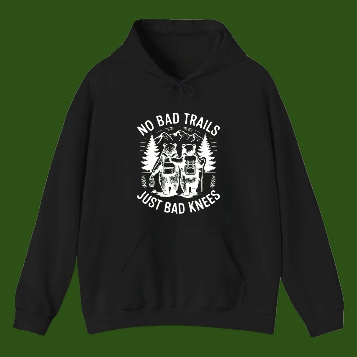 Two cartoon bears with backpacks hiking in mountains with text 'No Bad Trails Just Bad Knees' - humorous outdoor camping design