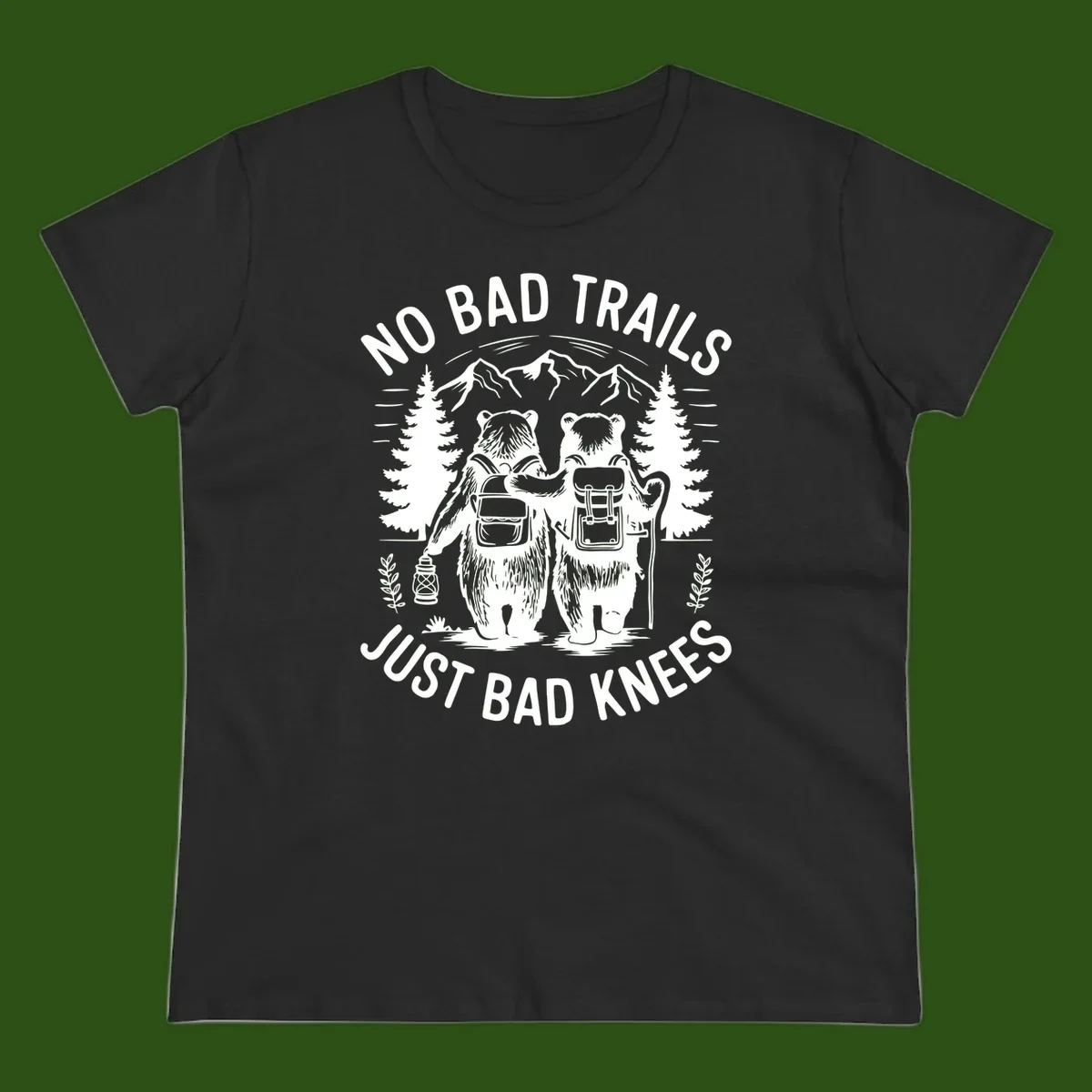 Two cartoon bears with backpacks hiking in mountains with text 'No Bad Trails Just Bad Knees' - humorous outdoor camping design