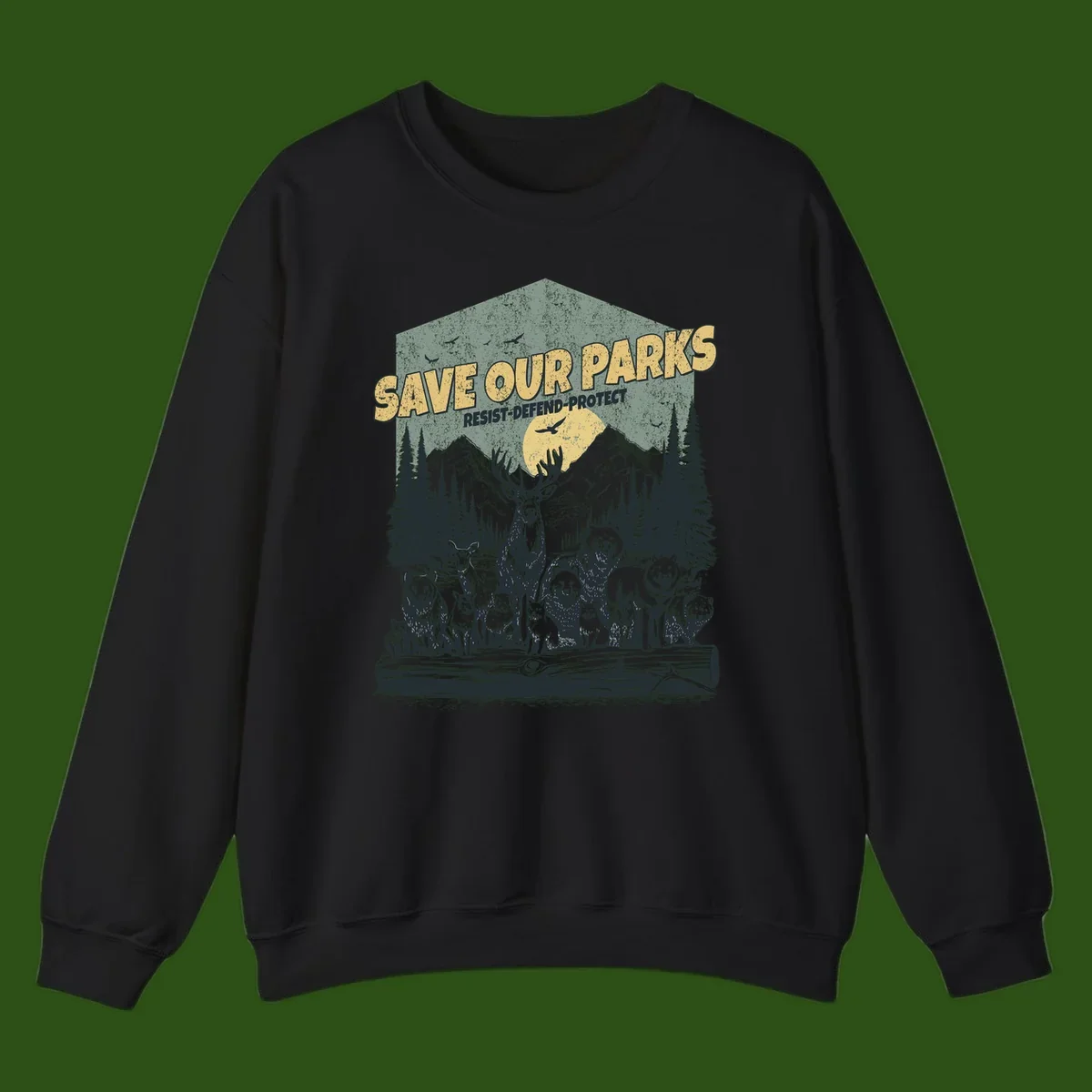 Vintage illustration of elk, bears, wolves and deer gathered in a moonlit forest with mountains, text reads 'Save Our Parks Resist-Defend-Protect'