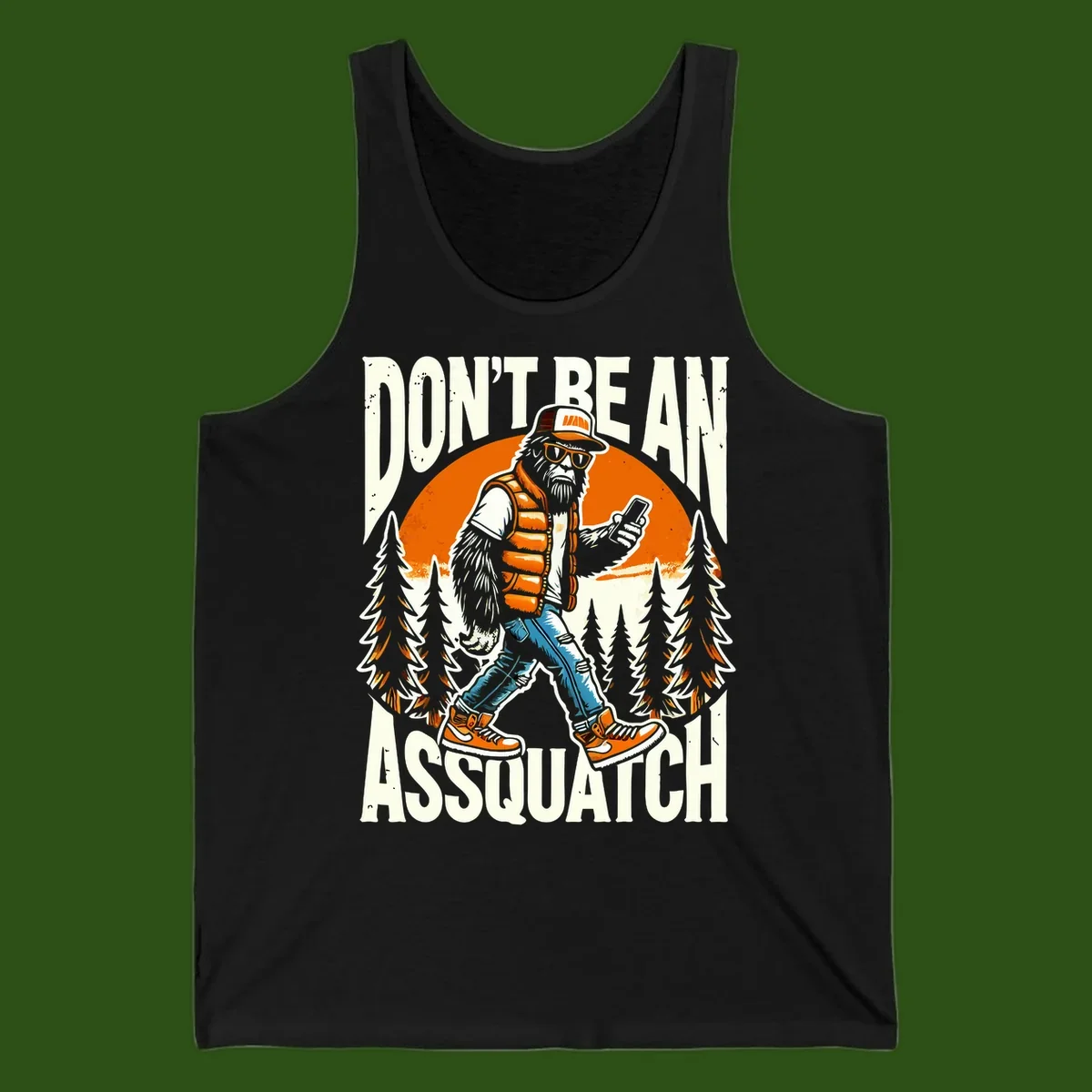 Cartoon sasquatch in hiking gear with backpack and smartphone, 'Don't Be An Assquatch' text, forest and orange sun background.