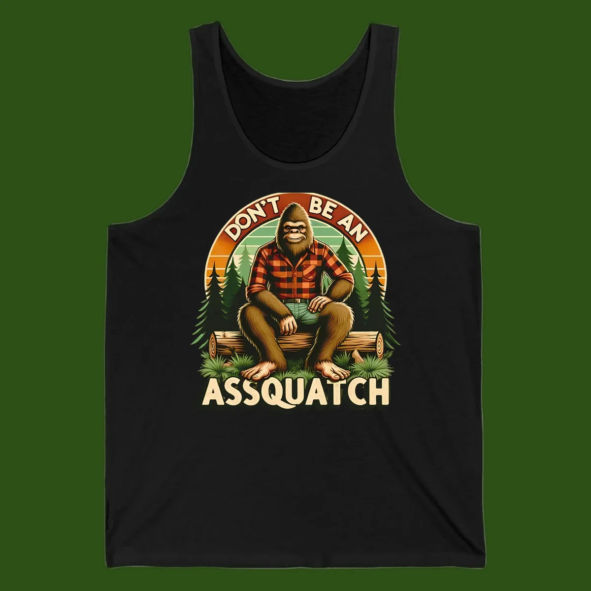 Vintage badge design with friendly Bigfoot in plaid shirt sitting on a log with forest trees, text reads 'Don't Be An Assquatch'