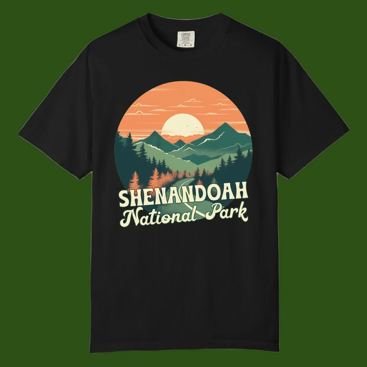 Vintage-style illustration of Shenandoah National Park with layered mountains, evergreen forests, and a large orange sunset sky with text reading Shenandoah National Park.
