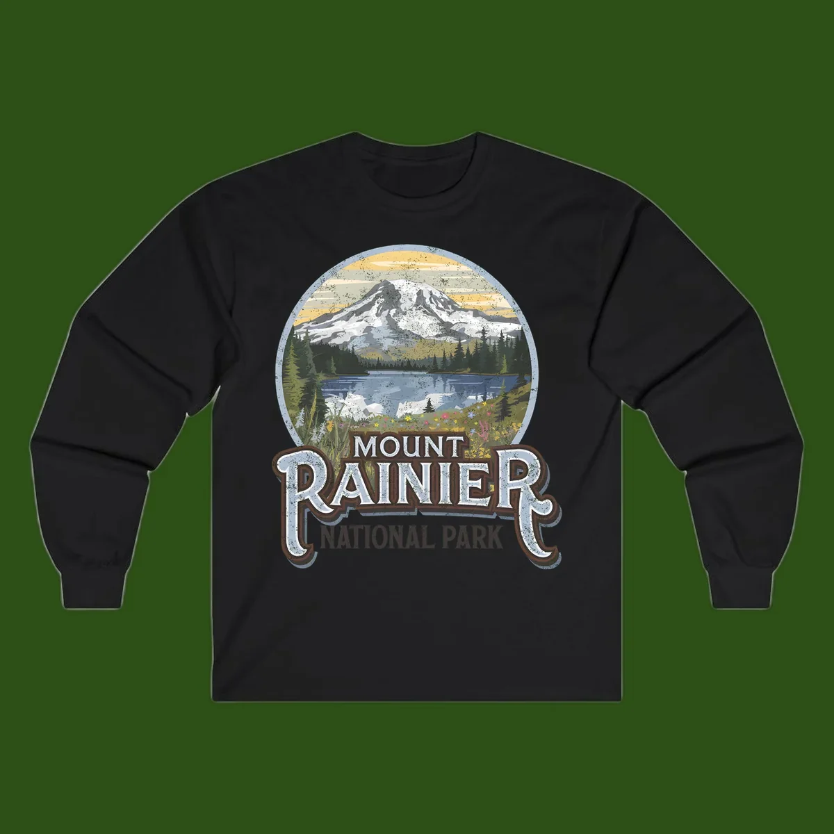 Vintage Mount Rainier National Park badge design with snow-capped peak, alpine lake, evergreen forest, and wildflowers on distressed background