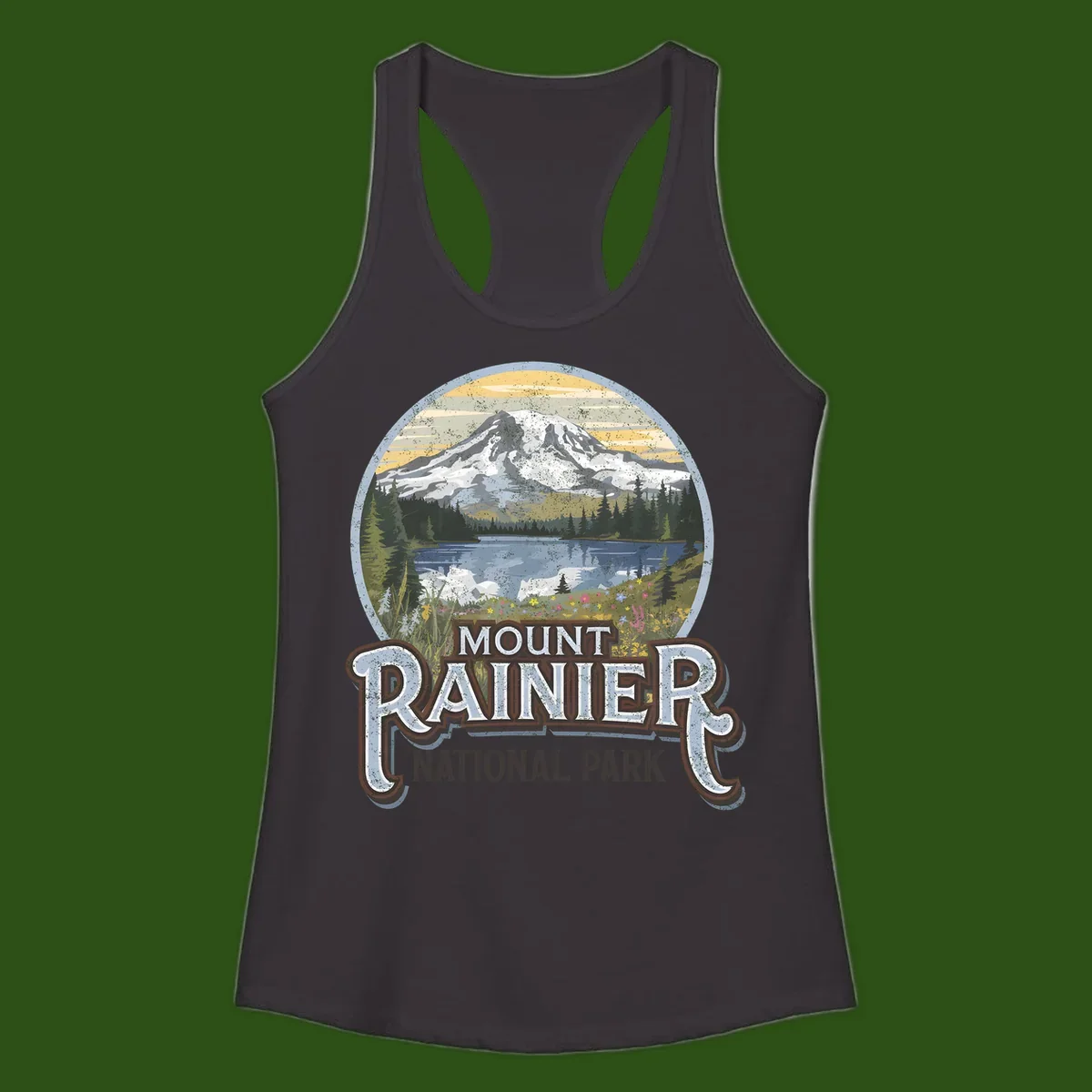 Vintage Mount Rainier National Park badge design with snow-capped peak, alpine lake, evergreen forest, and wildflowers on distressed background