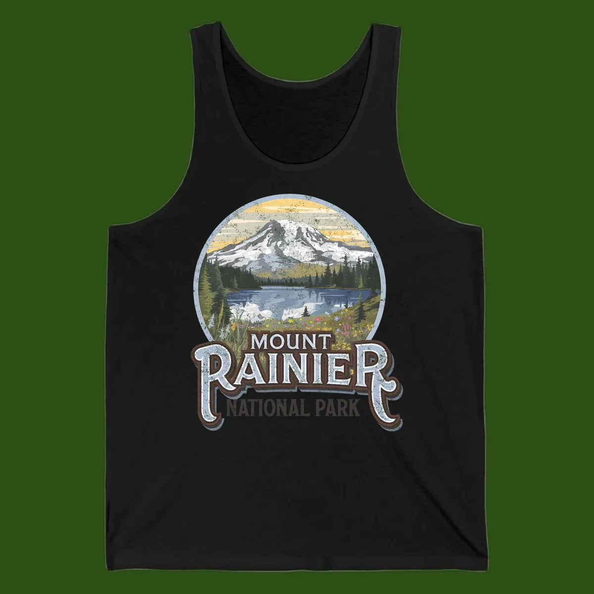 Vintage Mount Rainier National Park badge design with snow-capped peak, alpine lake, evergreen forest, and wildflowers on distressed background