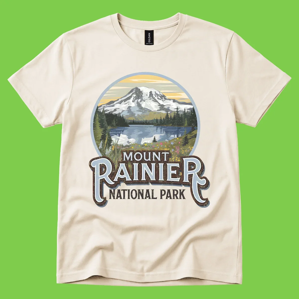Vintage Mount Rainier National Park badge design with snow-capped peak, alpine lake, evergreen forest, and wildflowers on distressed background