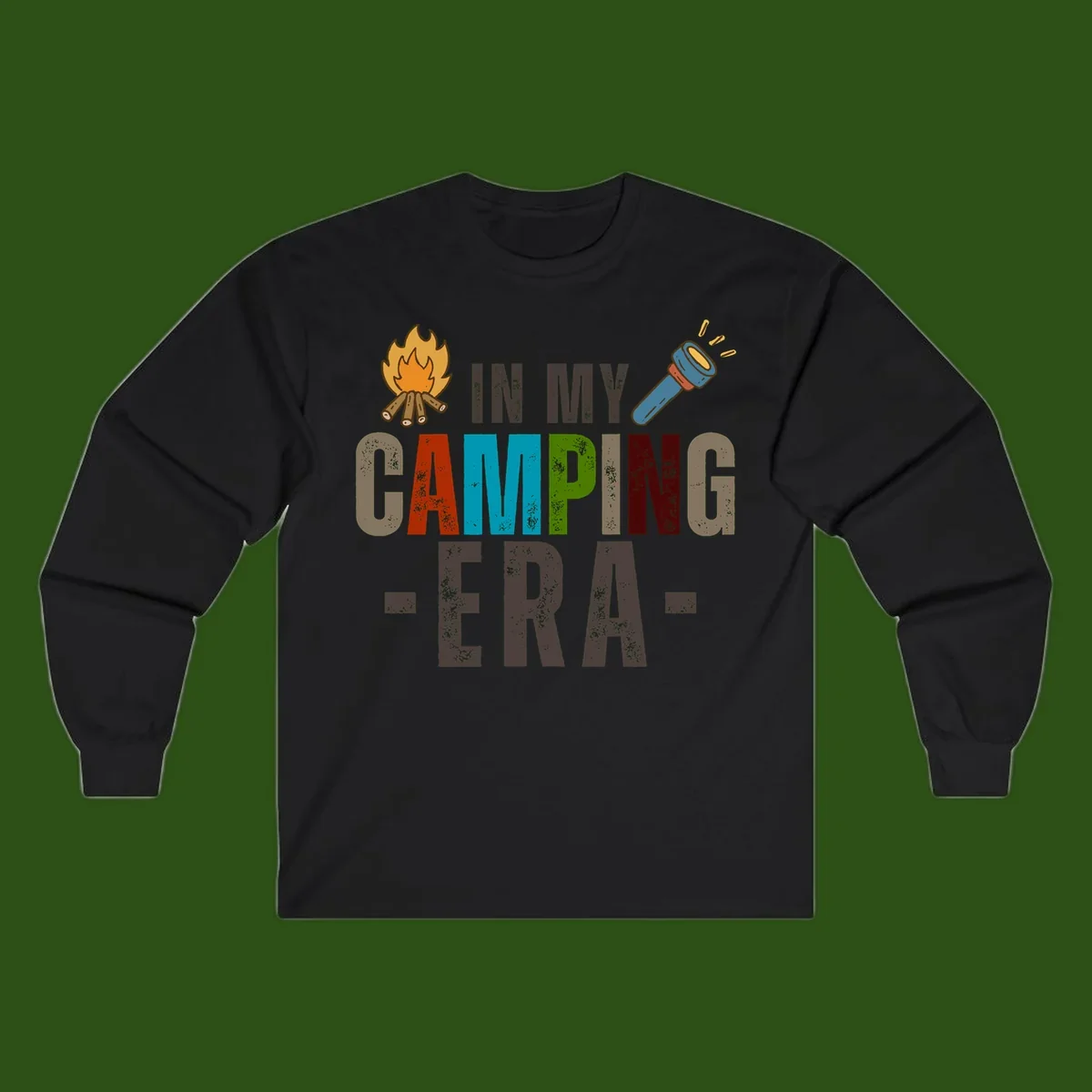 Campfire and flashlight icons flank colorful distressed text reading 'In My Camping Era' on gray background