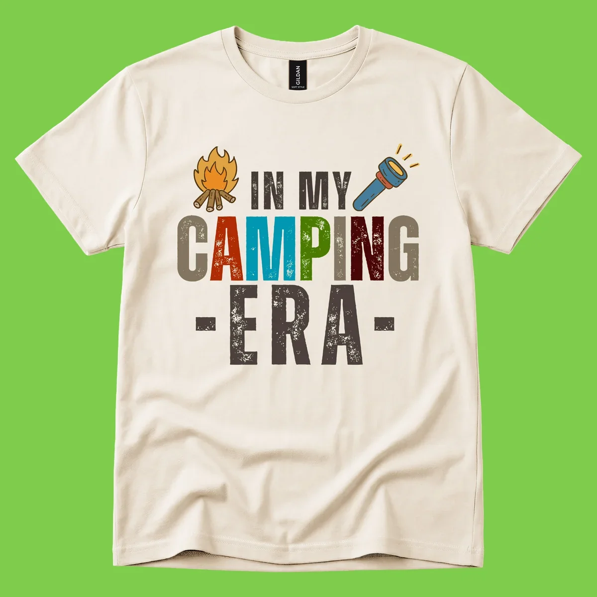 Campfire and flashlight icons flank colorful distressed text reading 'In My Camping Era' on gray background