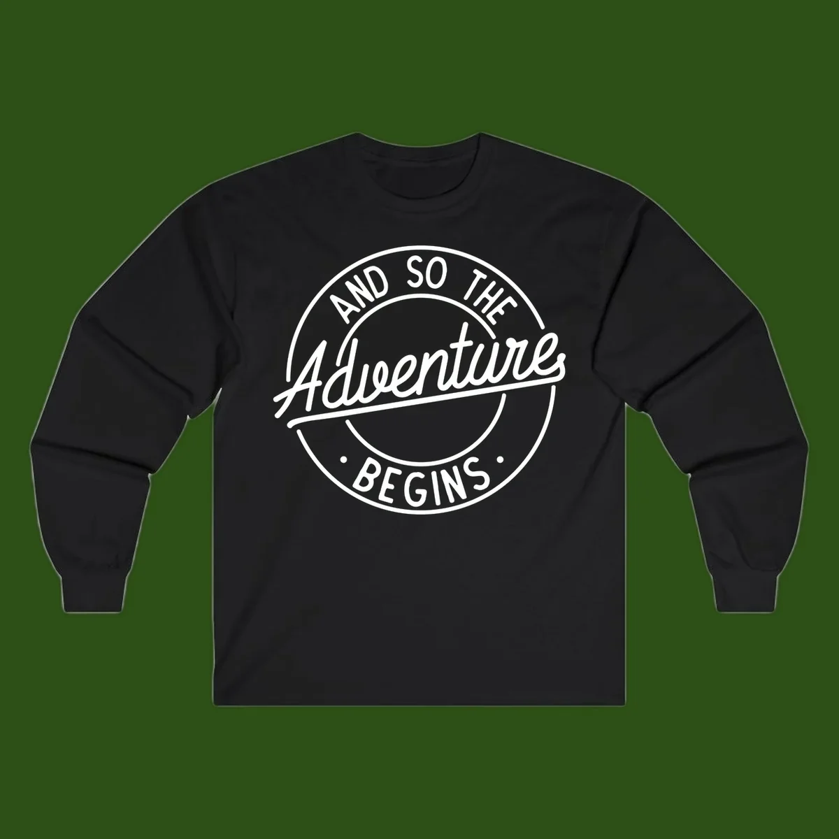 Vintage circular badge design with white text reading 'And So The Adventure Begins' on gray background