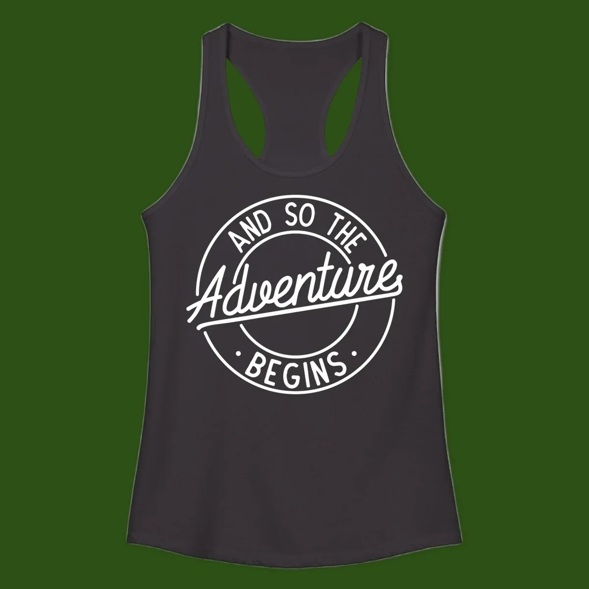 Vintage circular badge design with white text reading 'And So The Adventure Begins' on gray background