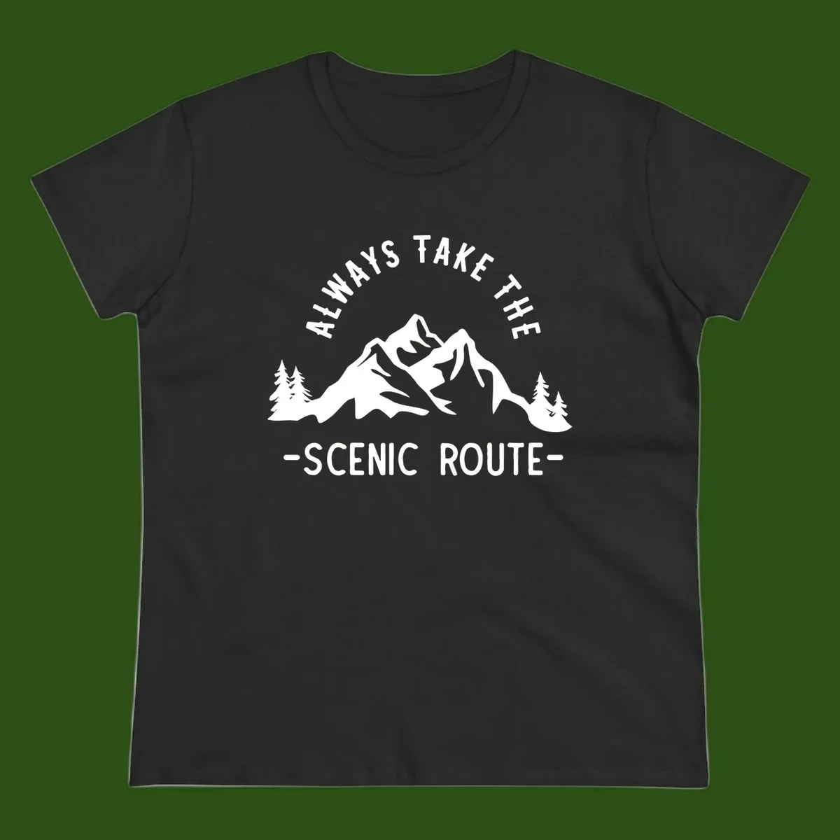 Mountain landscape with evergreen trees and text reading 'Always Take The Scenic Route' in bold lettering