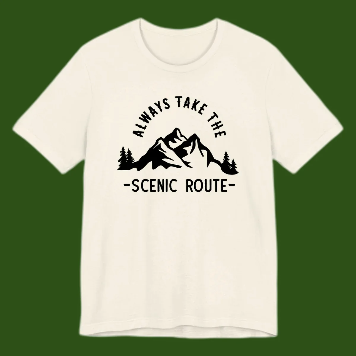 Mountain landscape with evergreen trees and text reading 'Always Take The Scenic Route' in bold lettering