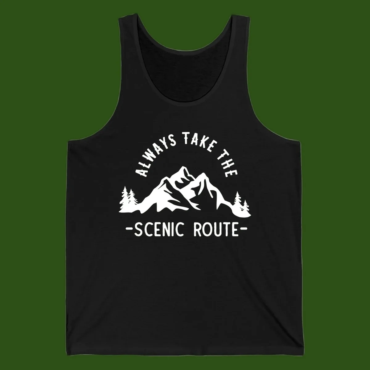 Mountain landscape with evergreen trees and text reading 'Always Take The Scenic Route' in bold lettering
