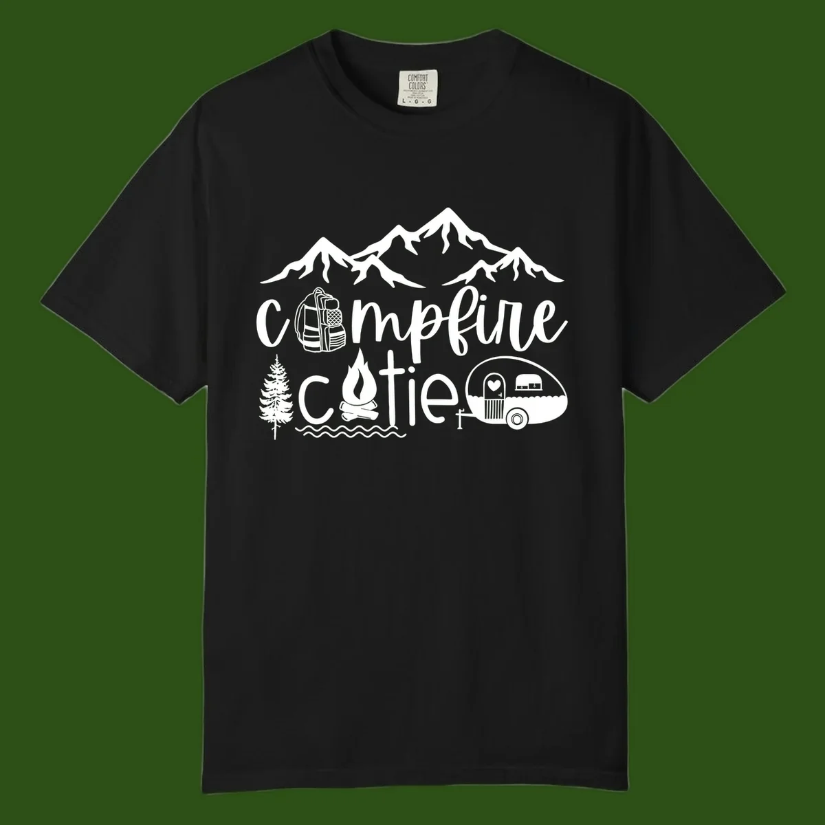 Campfire cutie camping design with mountains, backpack, camper trailer, campfire, and pine tree in white on gray background