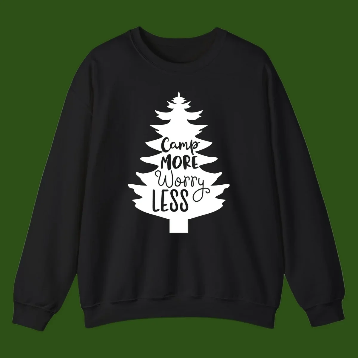 White evergreen tree silhouette with text reading 'Camp MORE Worry LESS' centered in the branches on gray background