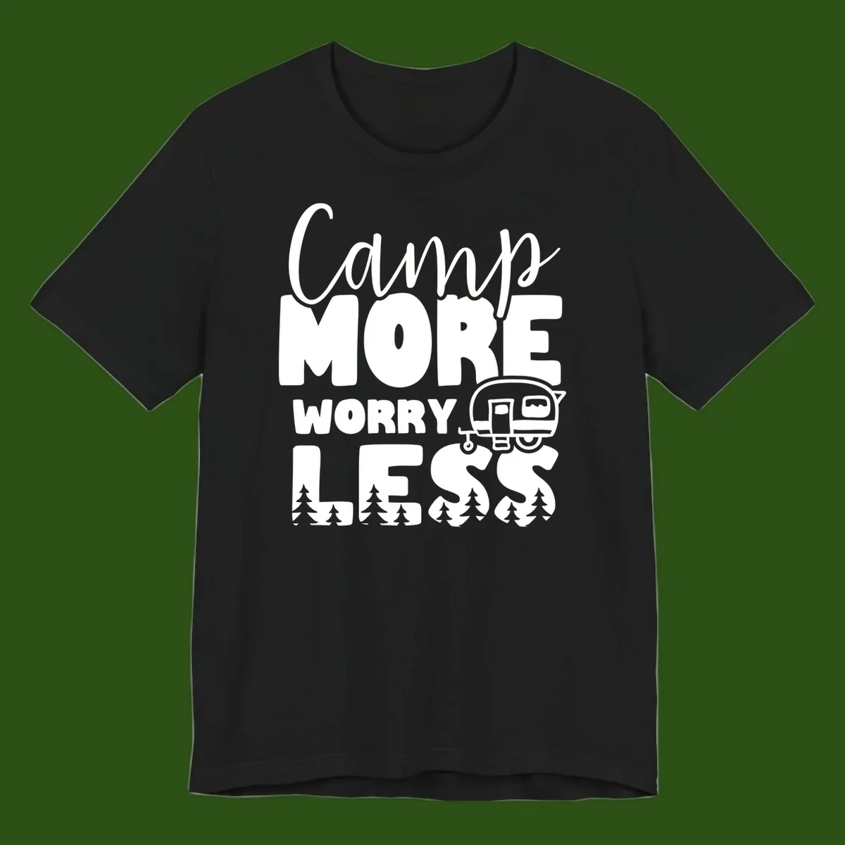 Camp More Worry Less design with flowing script text, camping trailer, and pine trees on gray background