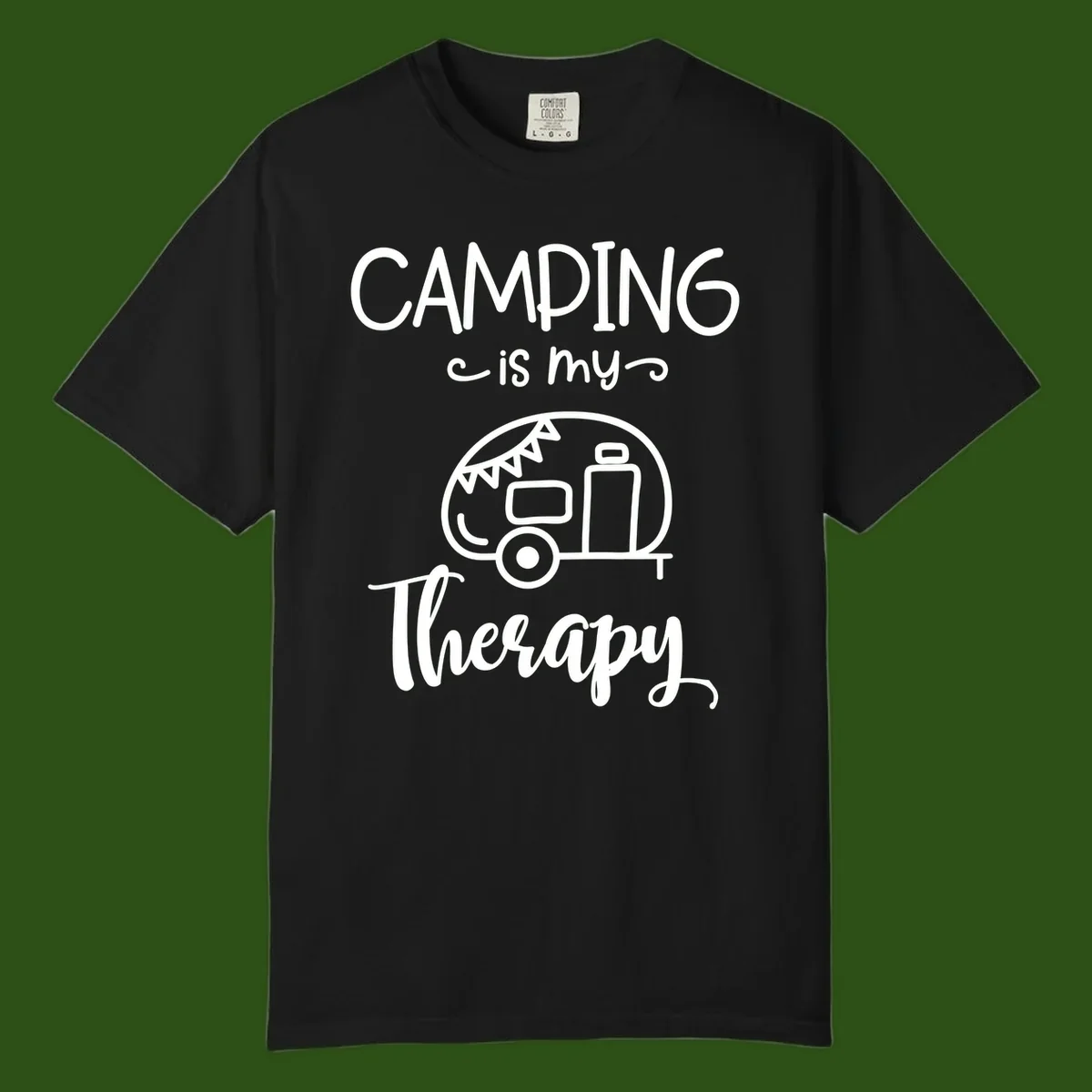 White line drawing of vintage travel trailer with bunting and text reading 'Camping is my Therapy' on gray background