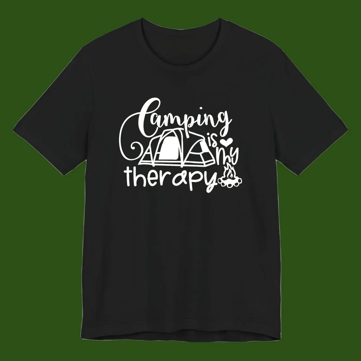 White lettered design reading 'Camping is Therapy' with heart symbol, tent, and campfire illustration on gray background