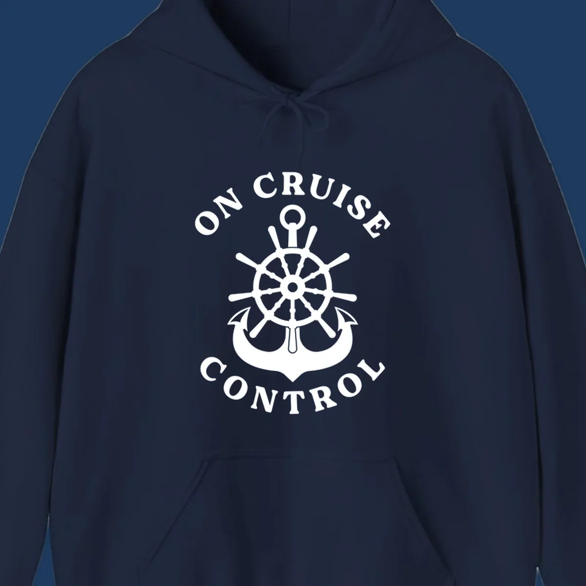 On cruise control nautical badge with ship wheel, anchors, crown and shield design in white on gray background.