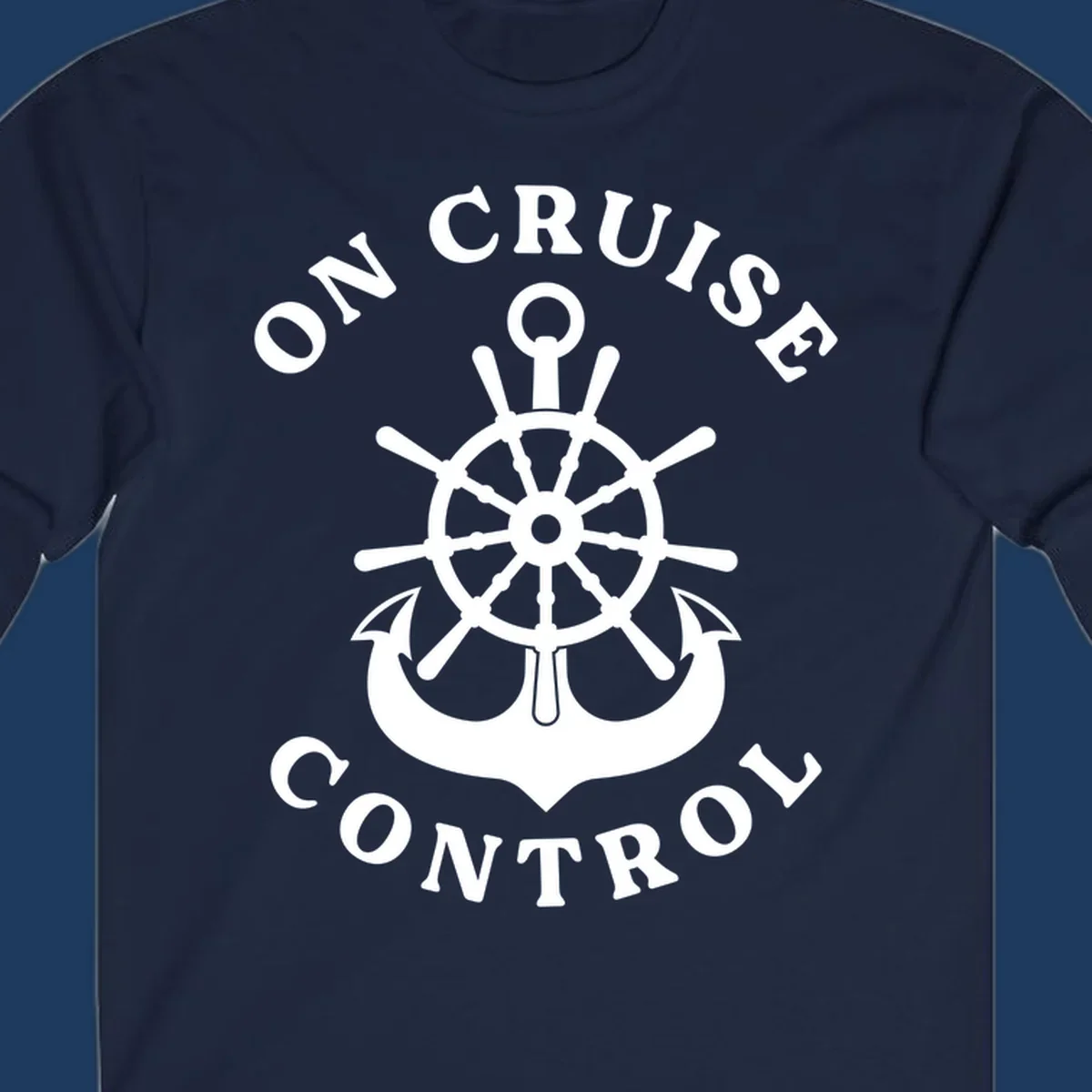 On cruise control nautical badge with ship wheel, anchors, crown and shield design in white on gray background.