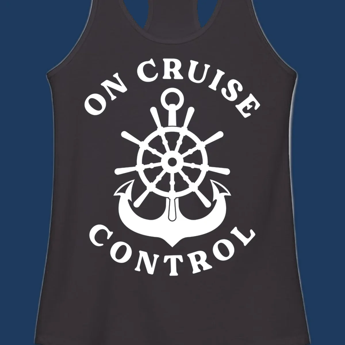On cruise control nautical badge with ship wheel, anchors, crown and shield design in white on gray background.