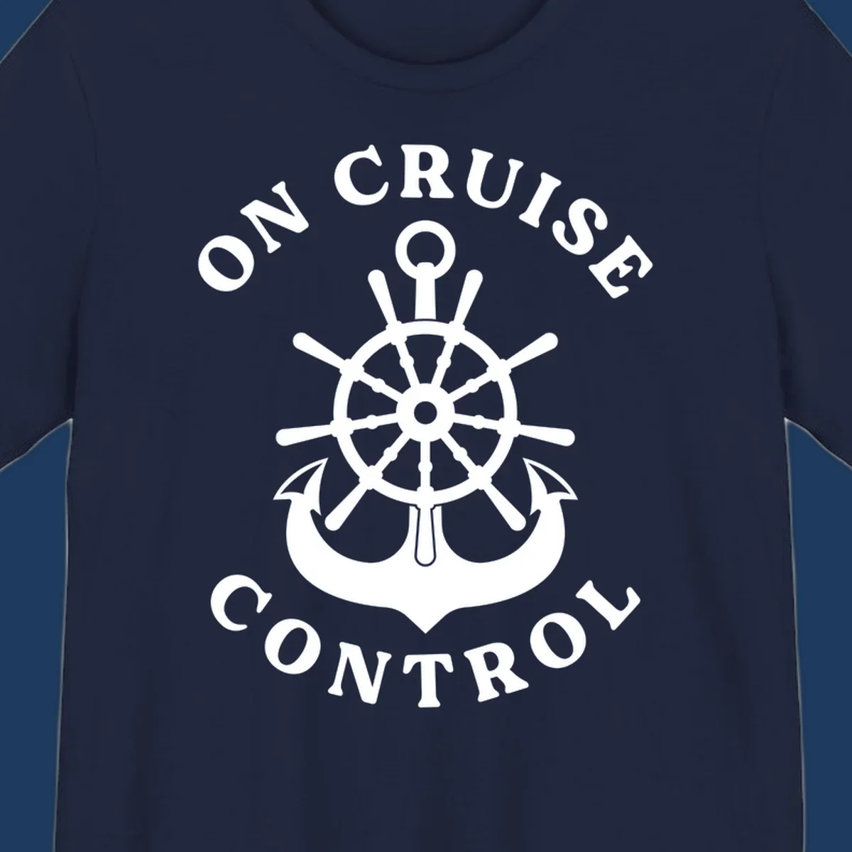 On cruise control nautical badge with ship wheel, anchors, crown and shield design in white on gray background.