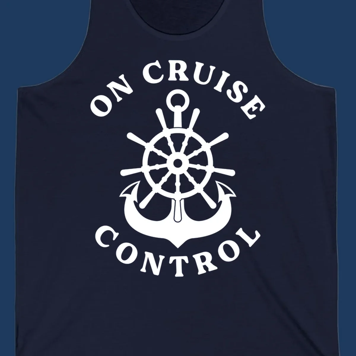 On cruise control nautical badge with ship wheel, anchors, crown and shield design in white on gray background.