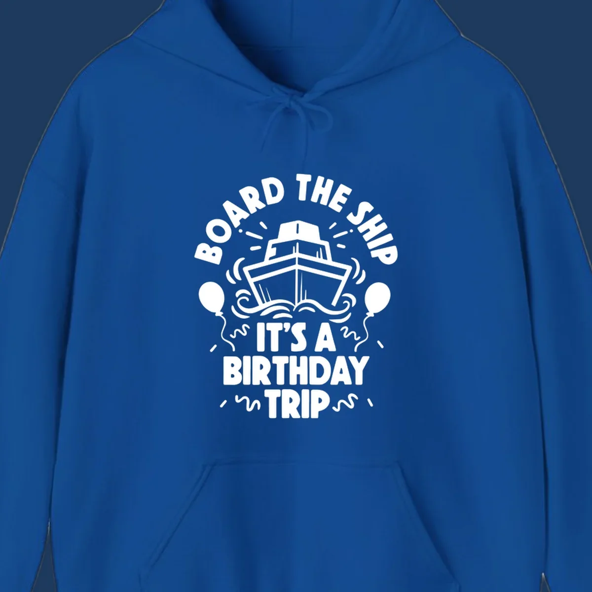 White cruise ship with balloons and confetti surrounded by text reading 'Board the Ship It's a Birthday Trip' on gray background
