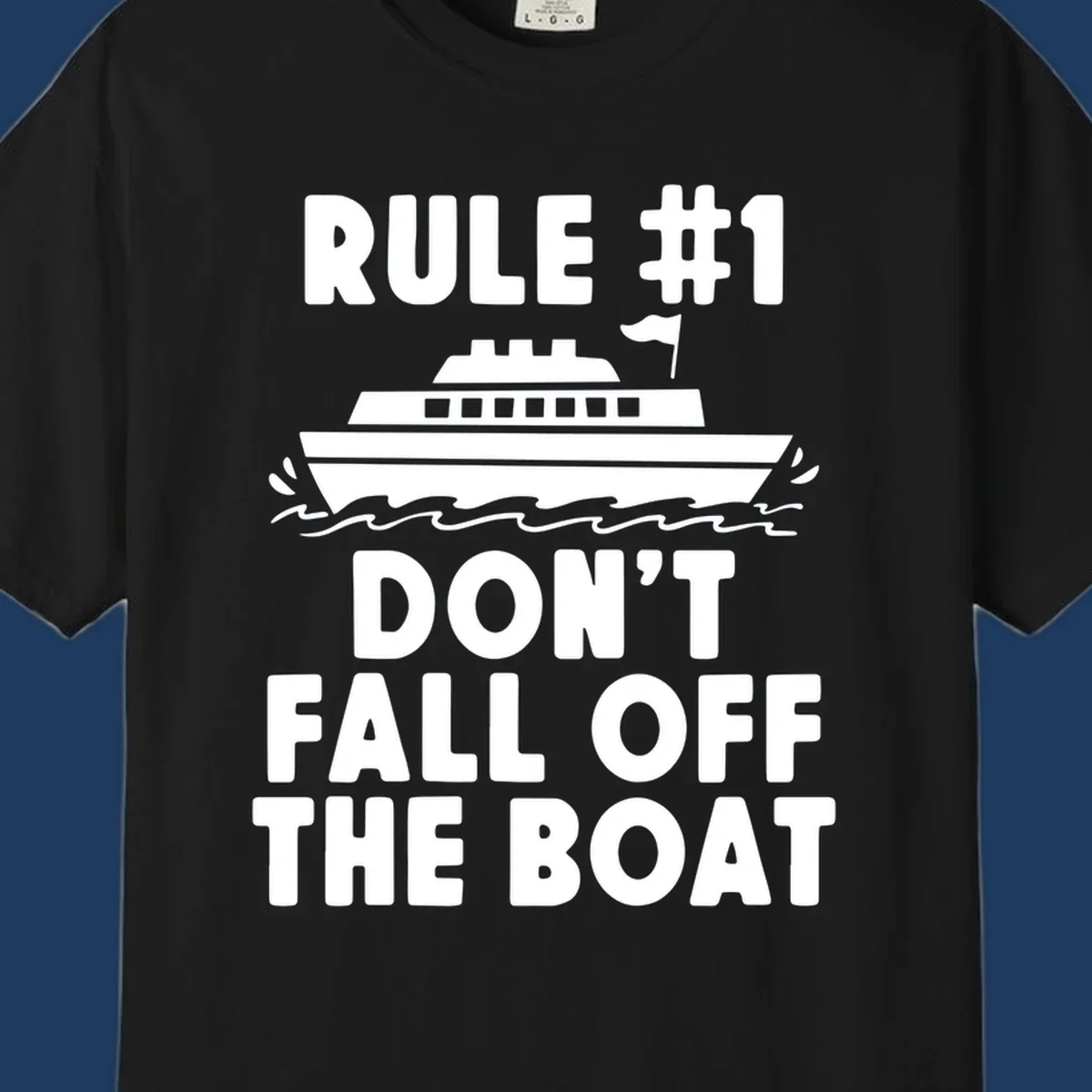 Humorous cruise design with ship illustration and text reading 'Rule #1 Don't Fall Off The Boat' on gray background