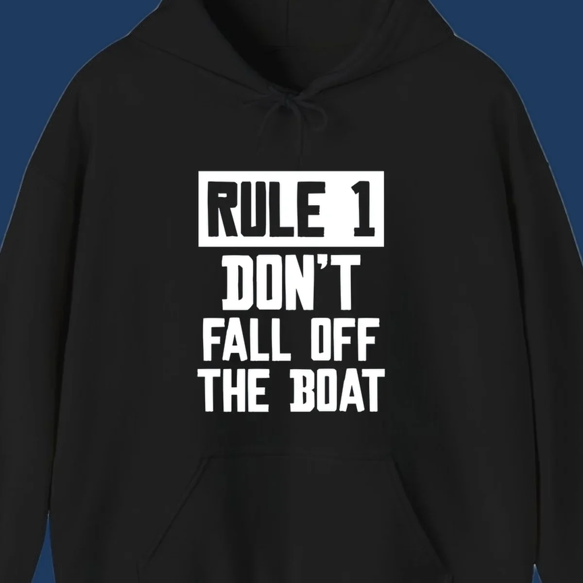 Bold gray and white typography reading 'Rule 1 Don't Fall Off The Boat' - a humorous nautical design