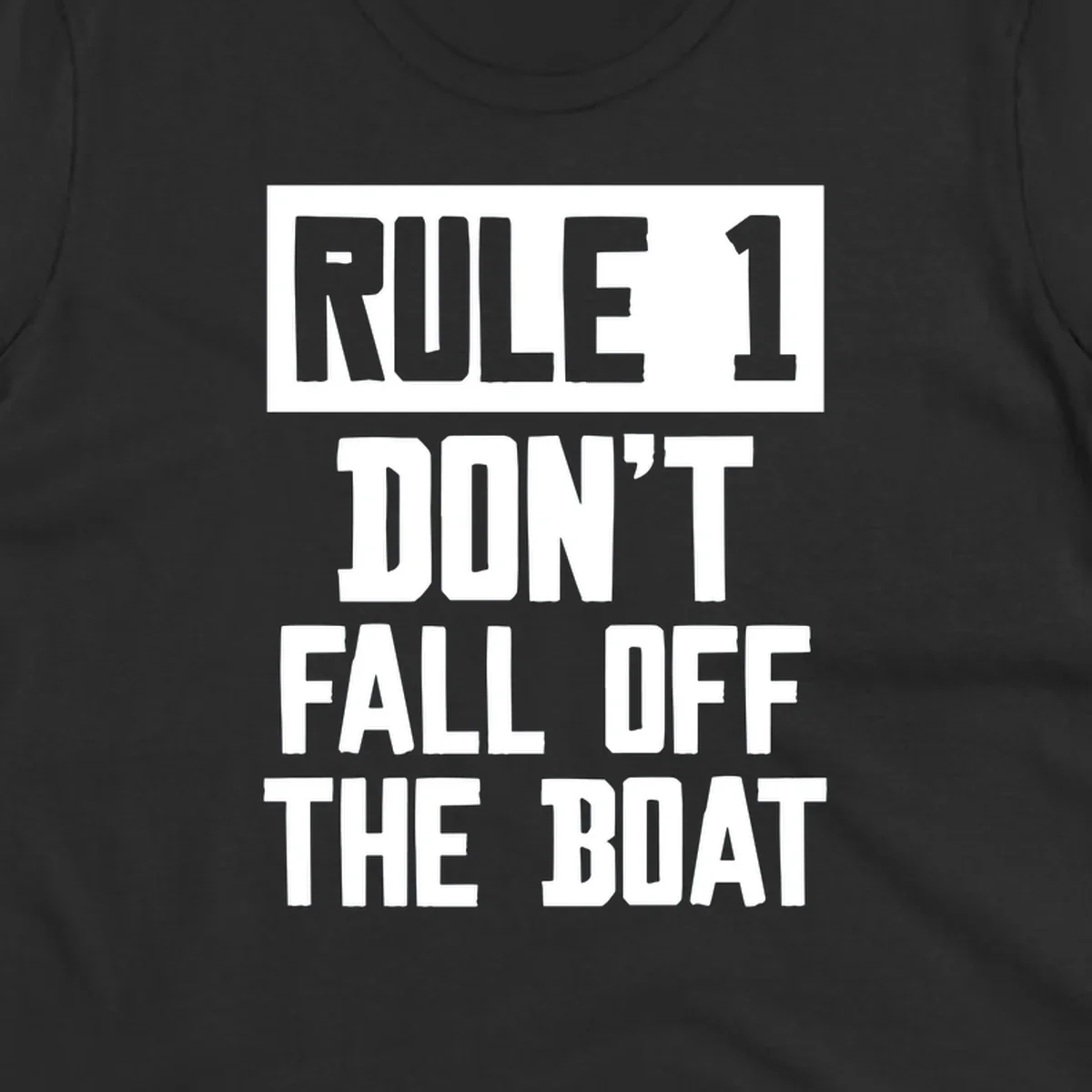 Bold gray and white typography reading 'Rule 1 Don't Fall Off The Boat' - a humorous nautical design
