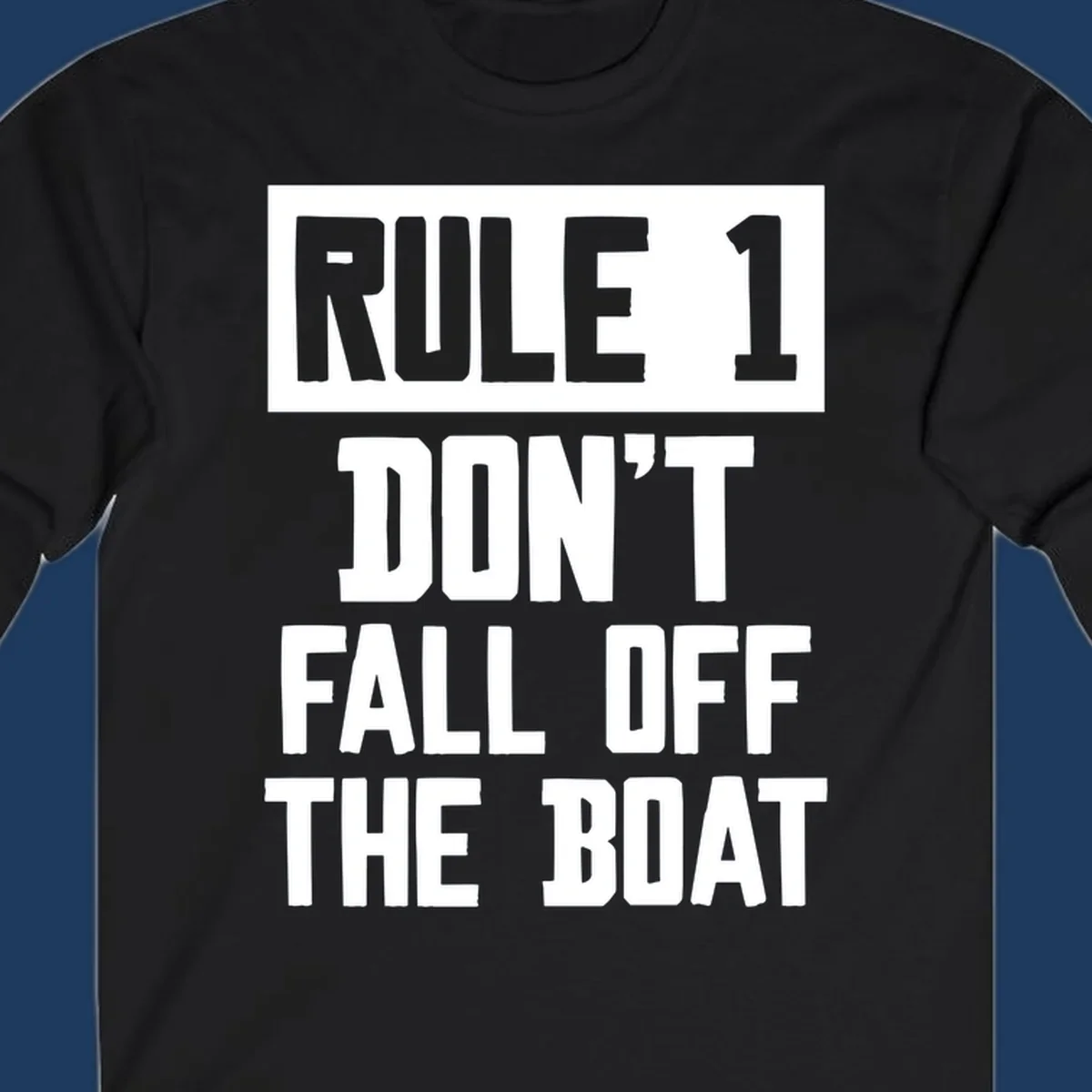 Bold gray and white typography reading 'Rule 1 Don't Fall Off The Boat' - a humorous nautical design