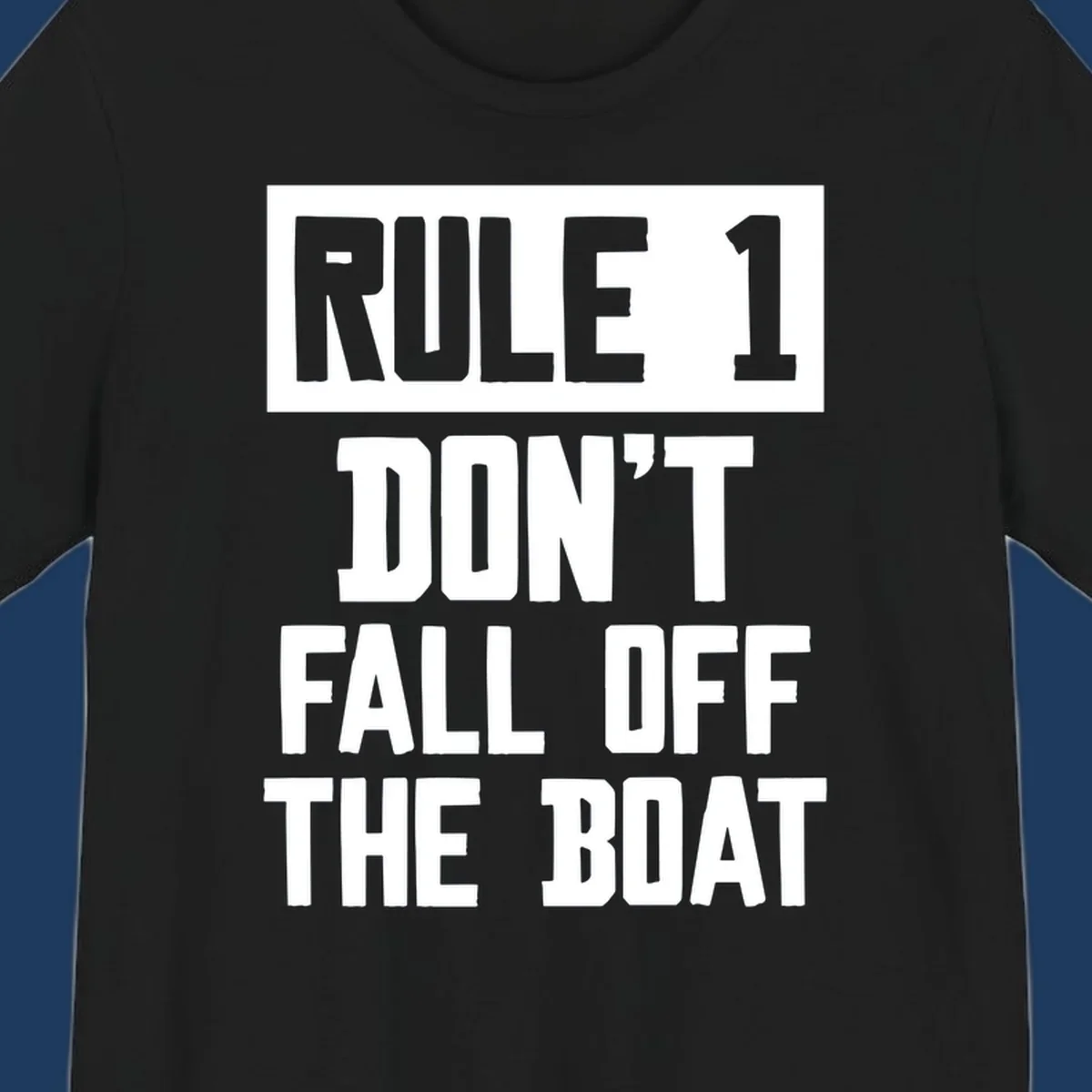 Bold gray and white typography reading 'Rule 1 Don't Fall Off The Boat' - a humorous nautical design